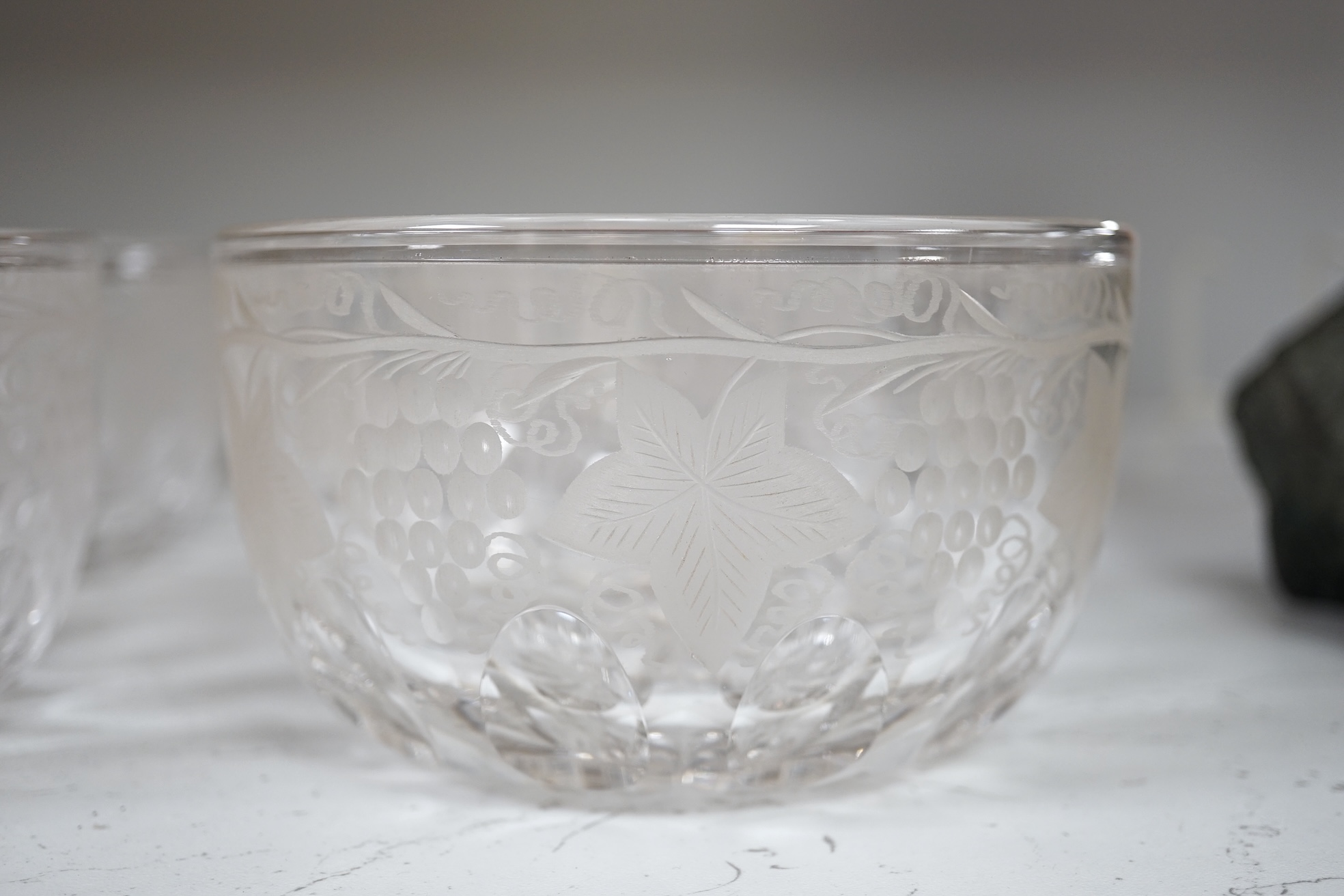 Nine vine engraved glass finger bowls, 13cm diameter. Condition - good.